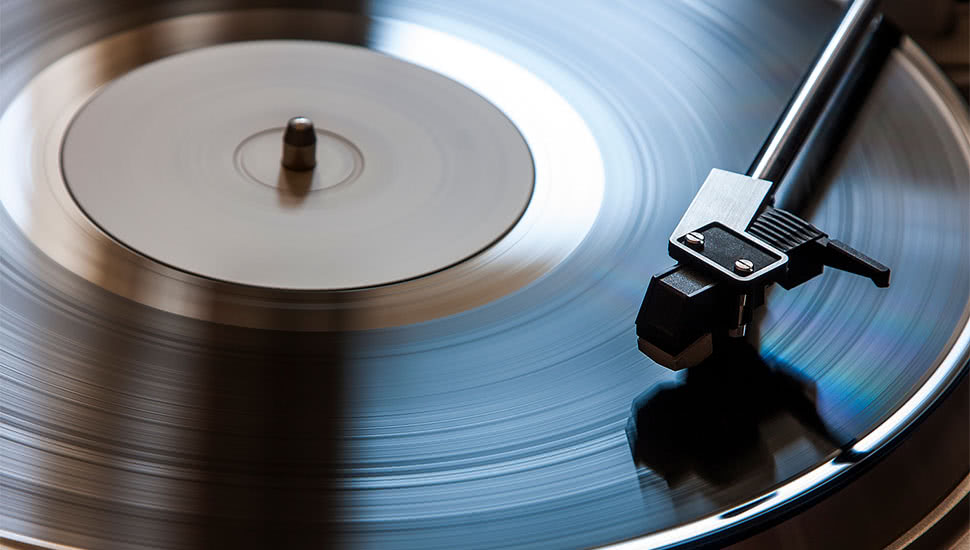 Image of a vinyl record on a record player